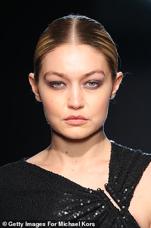 Smokey: Black eyeshadow was smeared on the upper and lower eyelids to showcase the runway;  Pictured is Gigi Hadid