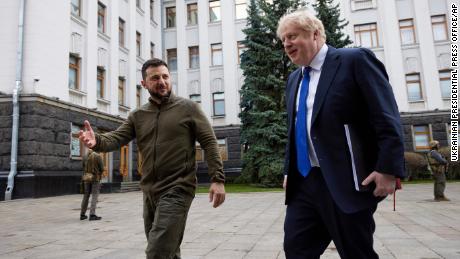 In this photo provided by the Ukrainian Presidential Press Office, Ukrainian President Volodymyr Zelensky, left, welcomes British Prime Minister Boris Johnson to Kyiv.