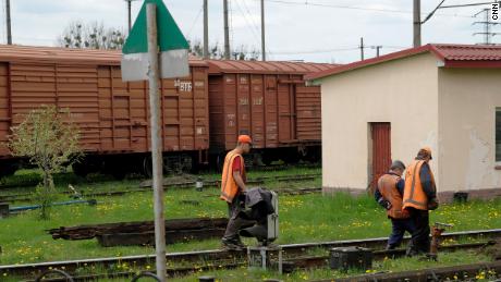 Railway workers repair part of the railway connecting Lviv to Poland.