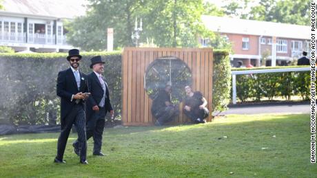 Race-goers cool off in the heat during Royal Ascot 2022 as a heat wave hits Western Europe. 