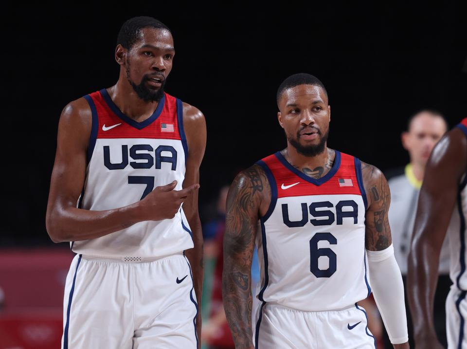 American Kevin Durant L talks with Damien Lillard during the men's basketball semi-final between the US and Australia at the Tokyo 2020 Olympic Games in Saitama, Japan, August 5, 2021 (Photo by Meng Yongmin/Xinhua via Getty Images)