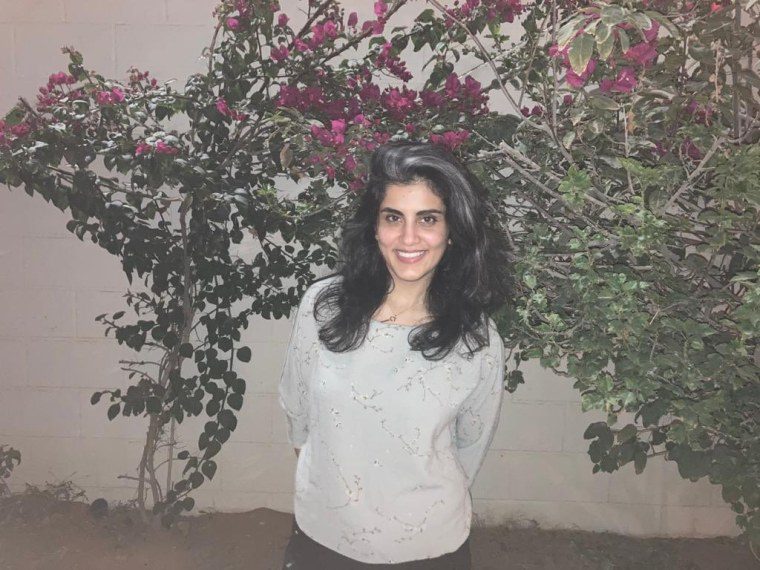 Loujain Al-Hathloul, a women's rights activist who is still banned from travel after being imprisoned, appeared in the photo after her release in February 2021. 