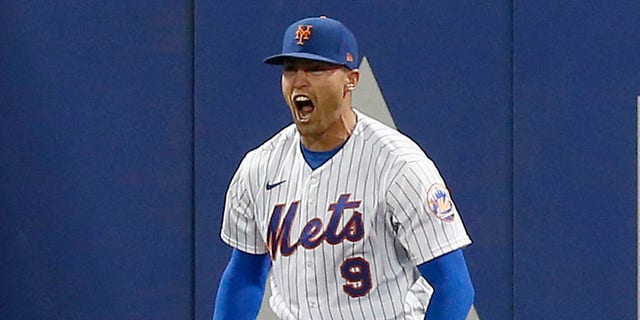 Brandon Nemo #9 of the New York Mets reacts after scoring in the seventh inning against the Los Angeles Dodgers at Citi Field on August 31, 2022 in New York City.