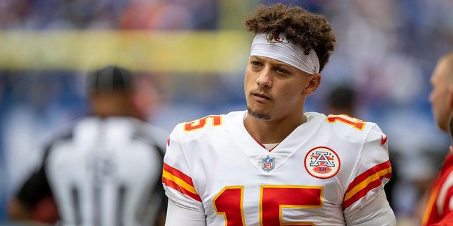 Kansas City Chiefs quarterback Patrick Mahomes, #15, looks on before the game against the Indianapolis Colts at Lucas Oil Stadium in Indianapolis on September 25, 2022. 