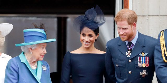 Queen Elizabeth II, pictured here with Meghan Markle and Prince Harry, allegedly in the summer of 2018. "weight" of deciding the benefits to be stripped from her grandson and his wife due to them leaving the country and stepping down from their position as senior members of the royal family.