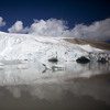 Glaciers are shrinking rapidly.  Scientists are rushing to find out how fast
